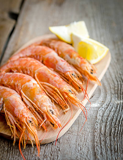 istock Shrimps on the wooden board 496686283