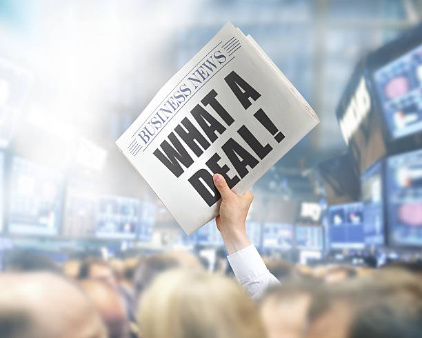 istock Holding Newspaper What a Deal 496686807