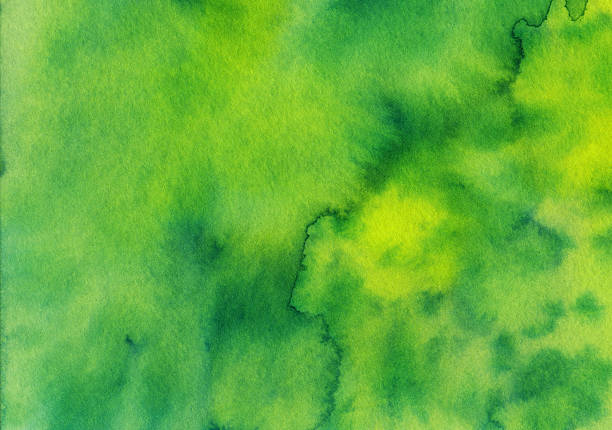 istock Bright green mottled watercolor and ink textured background 496686834