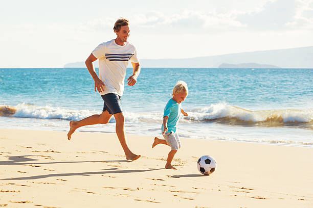 istock Father and Son Playing Soccer 496688072