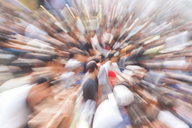 Blurred photo in zoom effect of a young man in b-boy breakdances battle at dance competitions.