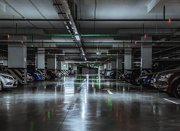 Parking garage with a few parked cars stock photo