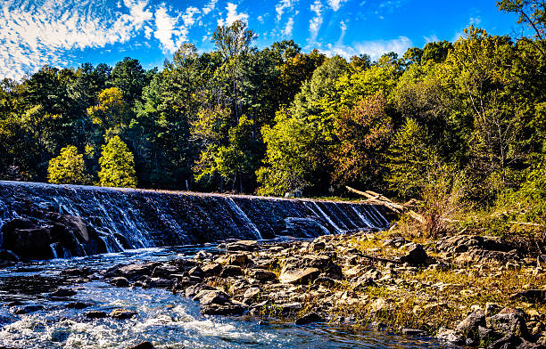 Falling Waters An image of the falling waters of the spillway in the Eno River in North Carolina. eno river stock pictures, royalty-free photos & images