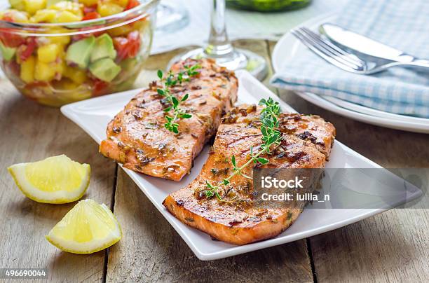 Spice Grilled Salmon With Mangoavocado Salsa On A White Plate Stock Photo - Download Image Now