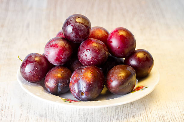 istock Juicy cherry-plums in a glass bowl 496698240