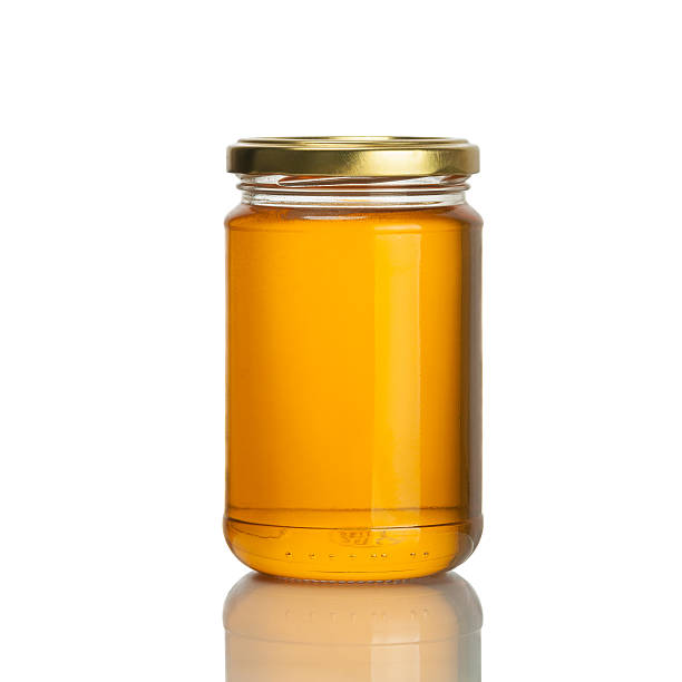 Miel pot sur fond blanc - Photo