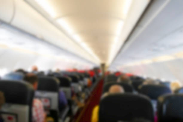 istock blurry defocused image of passenger in the airplane 496699330
