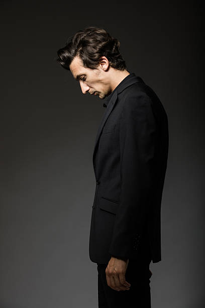 attractive man in black suit stock photo