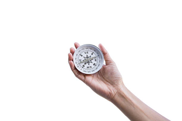 istock Traveler woman searching direction with a compass, on white back 496699604