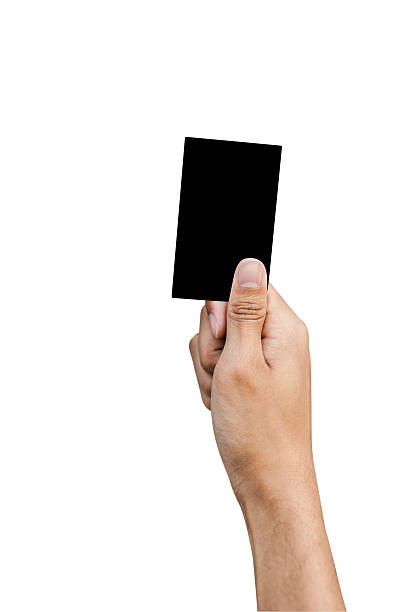 istock Hand of referee with Black card isolated on white background 496700481