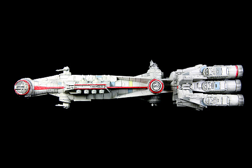 Vancouver, Canada - July 30, 2014: The Rebel blockade runner from the Star Wars movie franchise on a black background. The model was made for the X-Wing minature game for Fantasy Flight Games.