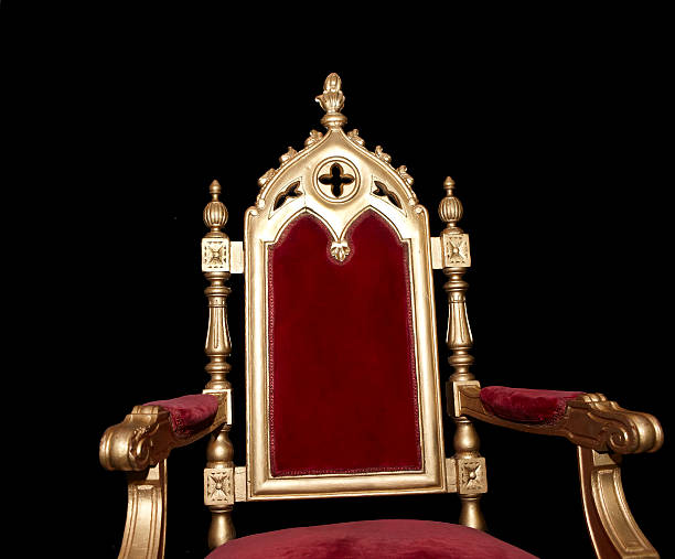 istock Golden royal chair isolated on black 496701047