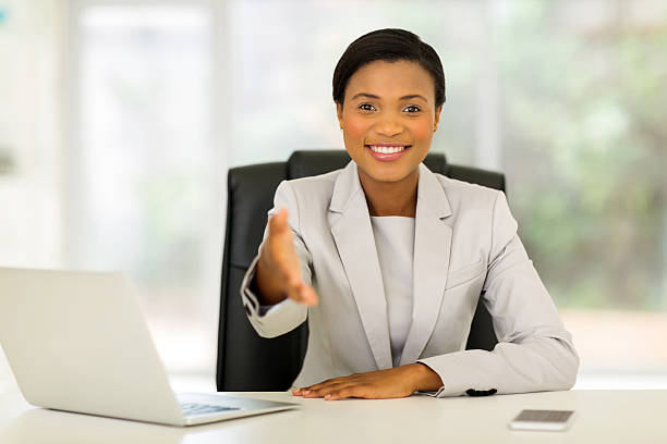 istock african businesswoman offering handshake 496701928