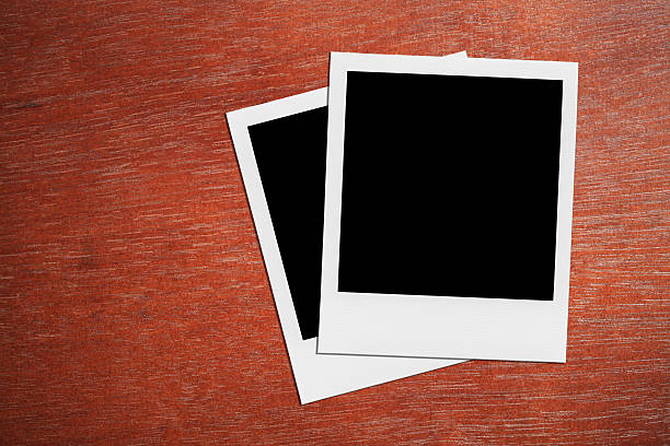 istock Blank Polaroid Photo Frames On The Desk. 496702495