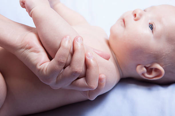 istock Three month baby boy arm massage 496702700