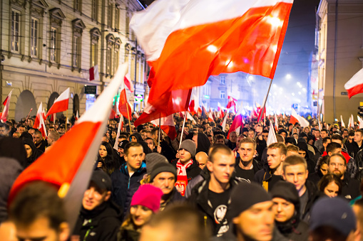 Krakow, Poland - November 11, 2015: Nationalists protest in center of Krakow. About 3.000 people took part in March of Free Poland. Participants chanted slogans Neither EU nor NATO, Poland only for Poles.
