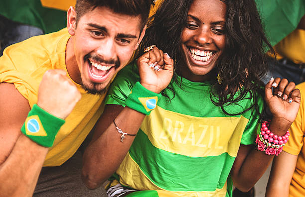 istock Group of brazilian supporters at stadium 496703481
