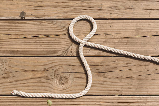 istock Rope on wooden background 496703514