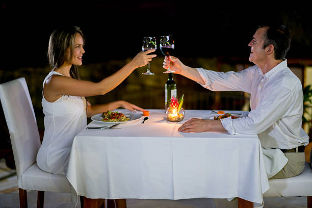 istock Couple making a toast in a romantic dinner 496703948