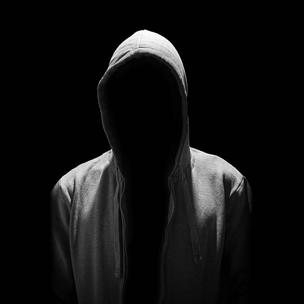Portrait of Invisible man in the hood isolated on black Portrait of Invisible man in the hood isolated on black background creepy stalker stock pictures, royalty-free photos & images