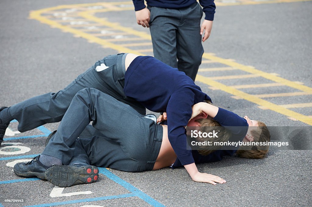 Two Boys Fighting In School Playground Two Boys Fighting In School Playground During Break Time Fighting Stock Photo