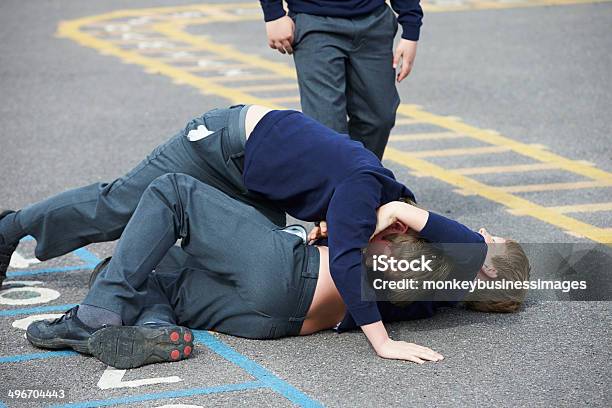 Two Boys Fighting In School Playground Stock Photo - Download Image Now - Fighting, Education, Child