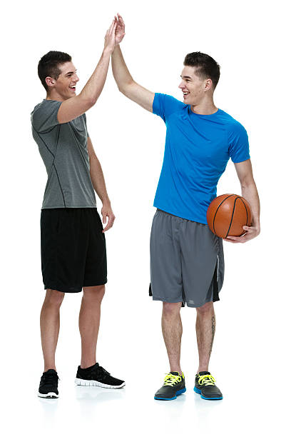 istock Smiling two teenagers giving high five 496704799