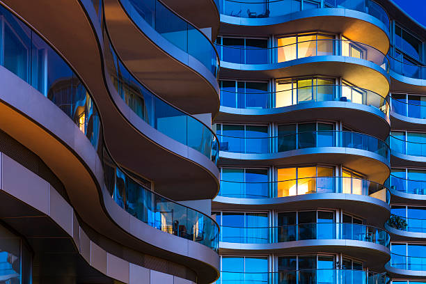 Luxury Apartments in London Balcony of Modern Building at Night in London apartments stock pictures, royalty-free photos & images