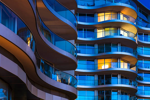 Luxury Apartments in London Balcony of Modern Building at Night in London flat stock pictures, royalty-free photos & images