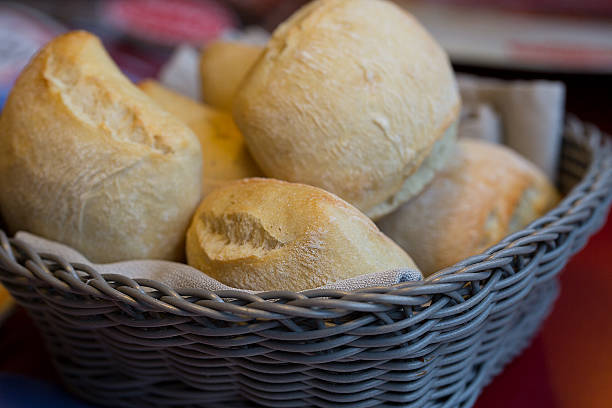 Bread in a gray basket on a table stock photo