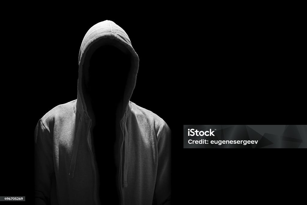 Portrait of Invisible man in the hood isolated on black Hood - Clothing Stock Photo