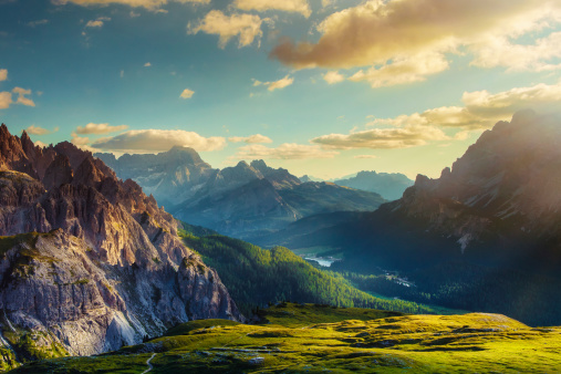 Mountains and valley at sunset. View from Tre Cime di Lavaredo to the direction of Lake Misurina, at the borders of Veneto (Belluno) and South Tyrol (Alto Adige) in the Dolomites, Italy.