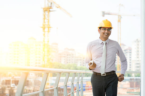 istock Asian Indian male site contractor engineer walking 496705362