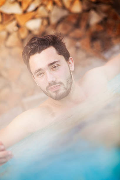 istock Young man in a hot tub 496706214