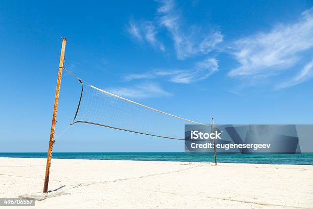 Net For Beach Volleyball On Empty Sea Coast Stock Photo - Download Image Now - Beach, Blue, Cloud - Sky