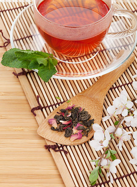 istock Japanese green tea and sakura branch 496707137