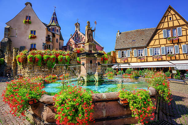Eguisheim, United Kingdom Half-timbered medieval houses decorated with flowers in Eguisheim village along the wine route in Alsace, France colmar stock pictures, royalty-free photos & images