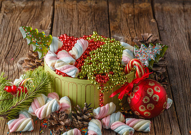 istock Christmas theme. Pine and red ball on wooden table 496709408