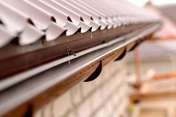 Holder gutter drainage system on the roof Holder gutter drainage system on the roof roof gutter photos stock pictures, royalty-free photos & images
