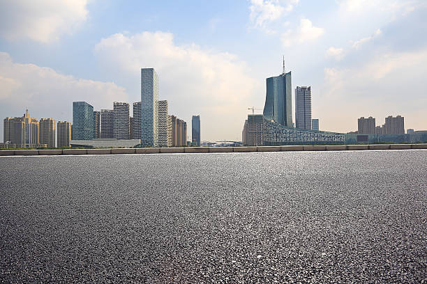 istock Empty road floor with City building background 496710780