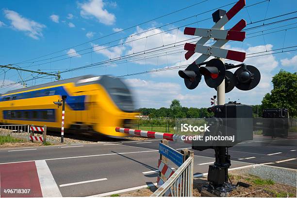 Train Riding Over A Rail Crossing In Spring Stock Photo - Download Image Now - Activity, Agricultural Field, Amsterdam