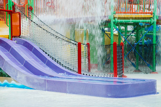 istock DOuble Purple Water Slide at Colorful Water Park 496718603