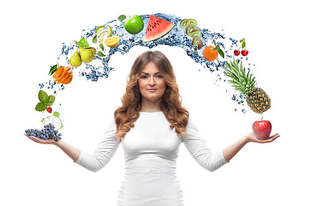istock smiling woman with fruits isolated 496722189