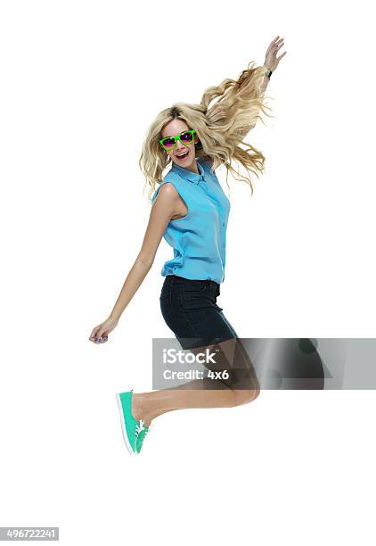 Cheerful Woman Jumping Stock Photo - Download Image Now - 20-29 Years, Adult, Adults Only