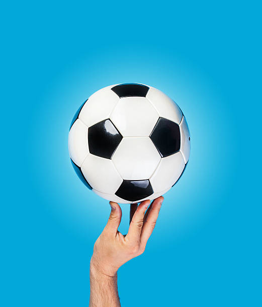 istock Hand hold ball on color background 496722943