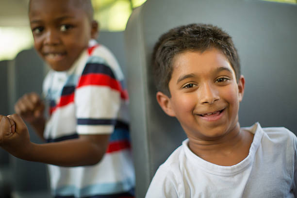 istock children sitting on school bus 496724223