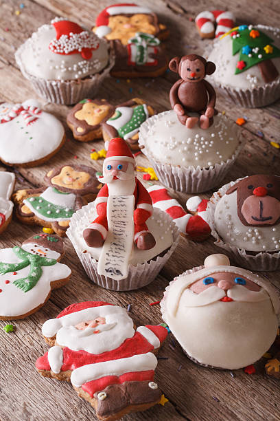 istock Delicious Christmas cupcakes and gingerbread close up. Vertical 496726276