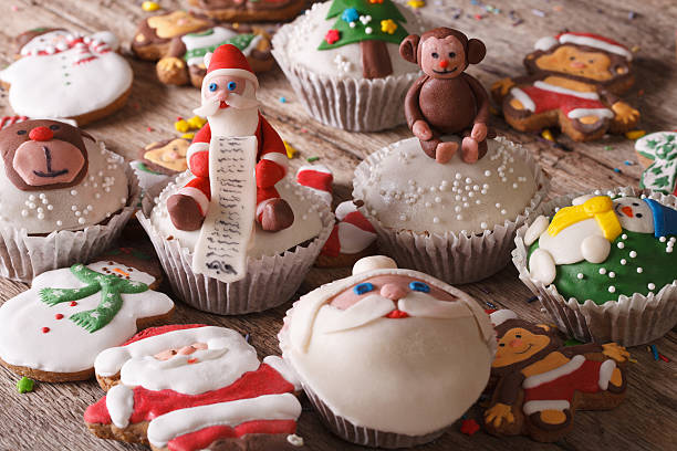 istock Delicious Christmas cupcakes and gingerbread close up. horizonta 496726550