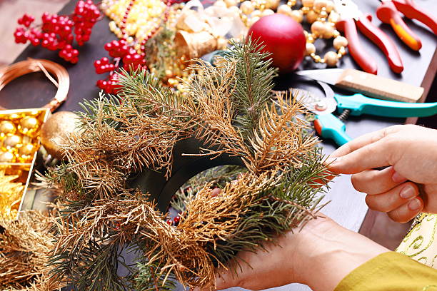 istock Woman making christmas advent wreath 496729048