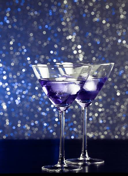 istock glasses of fresh cocktail with ice on bar table 496729568